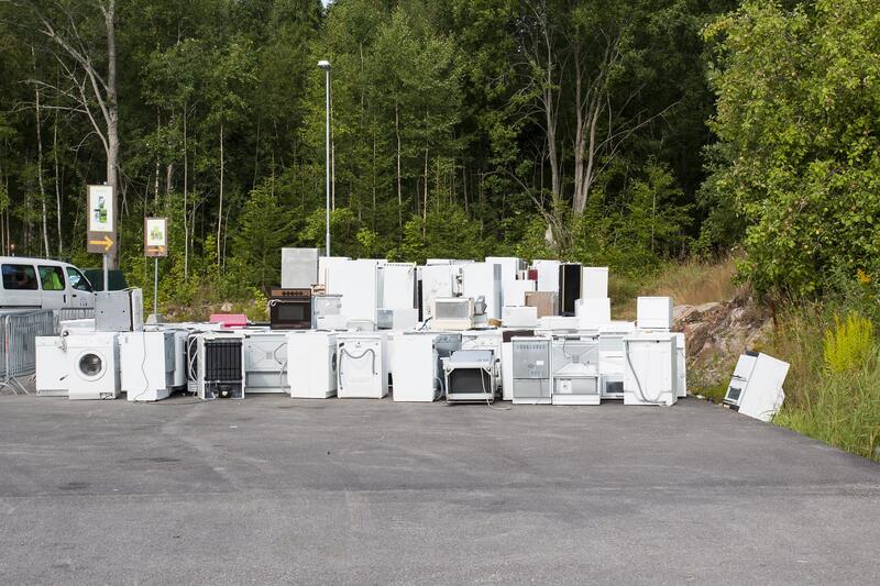 damaged white appliances on the road