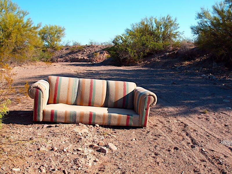 dirty sofa in the middle of nowhere
